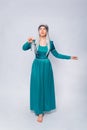 Full length portrait of a princess in a medieval, fantasy, turquoise dress with ash hair and a silver crown