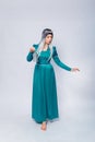 Full length portrait of a princess in a medieval, fantasy, turquoise dress with ash hair and a silver crown