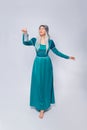 Full length portrait of a princess in a medieval, fantasy, turquoise dress with ash hair and a silver crown