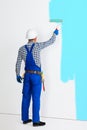 Full length portrait of rear view of painter man painting the wa