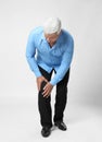 Full length portrait of senior man having knee problems Royalty Free Stock Photo