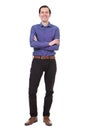 Full length smiling young man standing with arms crossed on white background Royalty Free Stock Photo