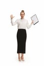 Full length portrait of a surprised female teacher holding a folder isolated against white background Royalty Free Stock Photo