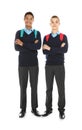 Full length portrait of teenage boys in school uniform with backpacks on white Royalty Free Stock Photo