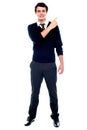 Full length portrait of teenager pointing away Royalty Free Stock Photo