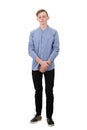 Full length portrait of thoughtful teenager guy looking down as feel guilty and ashamed isolated over white. Boy experiencing