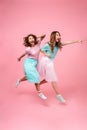 Full length portrait of a two excited joyful girls Royalty Free Stock Photo