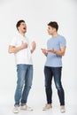 Full length portrait of two handsome young men Royalty Free Stock Photo