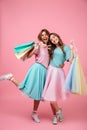 Full length portrait of two happy smiling girls Royalty Free Stock Photo