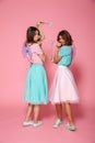 Full length portrait of a two smiling happy girls Royalty Free Stock Photo