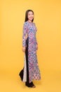 Full-length portrait of Vietnamese girl in ao-dai dress