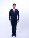 Full length portrait of a young asian businessman standing Royalty Free Stock Photo