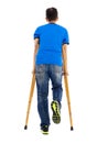 Full length portrait of Young asian man on crutches Royalty Free Stock Photo