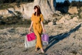 Smiling young woman with shopping bags walking the stairs at mall Royalty Free Stock Photo