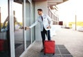 Full length portrait of young executive with a suitcase. Royalty Free Stock Photo