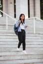 Full-length portrait of young happy asian woman, walking down st Royalty Free Stock Photo