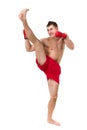 Full length portrait of young male boxer showing some movements against isolated white background Royalty Free Stock Photo
