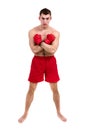 Full length portrait of young male boxer showing some movements against isolated white background Royalty Free Stock Photo