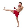 Full length portrait of young male boxer showing some movements against white background Royalty Free Stock Photo