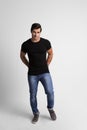 Full length portrait of  young man in casual clothes on grey background Royalty Free Stock Photo