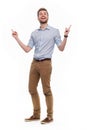 Full length portrait of young man pointing up Royalty Free Stock Photo