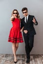 Full length portrait of a young serious couple Royalty Free Stock Photo