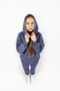 Full length portrait of young sporty fitness women in blue cotton hooded sweatsuit casual outfit. studio shot of blonde