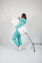 Full length portrait of young sporty fitness women in blue cotton hooded sweatsuit casual outfit playing with dummy