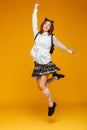 Full length portrait of a young teenage schoolgirl in uniform Royalty Free Stock Photo