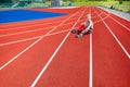 Young Woman Holding Water Bottle On Running Tracks Royalty Free Stock Photo