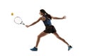 Full length portrait of young woman playing tennis isolated on white background Royalty Free Stock Photo