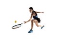 Full length portrait of young woman playing tennis isolated on white background Royalty Free Stock Photo