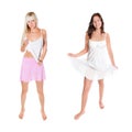 Full length portraits of two young women wearing white tops and short skirts Royalty Free Stock Photo