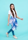 Full length of pretty cheerful teenager girl having fun good mood and posing in casual clothes isolated over blue Royalty Free Stock Photo