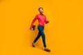 Full length profile photo of macho business man walk corporate meeting training carry laptop wear stylish red shirt bow Royalty Free Stock Photo