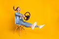 Full length profile side photo of astonished positive girl taxi rider sit chair hold steering wheel impressed fast speed Royalty Free Stock Photo