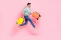 Full length profile side photo of attractive funny boy hurry airport registration move look empty space isolated on pink Royalty Free Stock Photo