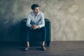 Full length profile side photo of thoughtful serious masculine freelancer sit black leather armchair have work thoughts