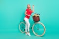 Full length profile side photo of young woman happy positive smile bicycle wave hello isolated over turquoise color Royalty Free Stock Photo