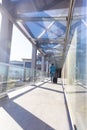 Full length rear view of african american businessman walking with luggage at airport corridor Royalty Free Stock Photo