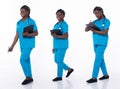 Full length 20s young African American Woman Medical Healthcare Nurse, walking forward left right Royalty Free Stock Photo