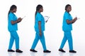 Full length 20s young African American Woman Medical Healthcare Nurse, walking forward left right Royalty Free Stock Photo