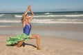 Full length of senior woman with arms raised on sand Royalty Free Stock Photo