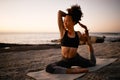 Yoga. Good for the mind, good for the body. Full length shot of an attractive young woman practicing yoga on the beach