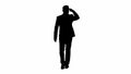 Silhouette Businessman walking and looking far away.