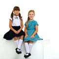 Full length shot of cute sitting girls