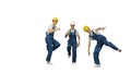 Three male construction workers in hard hats hoping into the cam Royalty Free Stock Photo