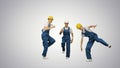 Three male construction workers in hard hats hoping into the cam Royalty Free Stock Photo