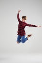 Funny young girl jumping in the air happily Royalty Free Stock Photo