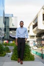 Full length shot of handsome black African businessman outdoors in city during summer Royalty Free Stock Photo